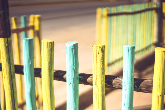 Bright stakes of wooden fence