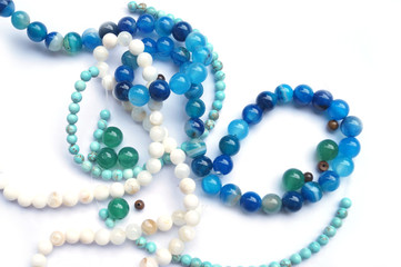 bundles of beads from turquoise, jadeite and agate