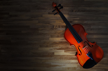 Fototapeta na wymiar Violin on rustic wooden background