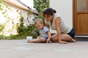 Mother playing with her child outside