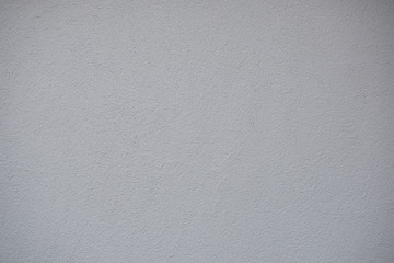 Very light grey just painted clean grunge plaster wall as abstract textured background.