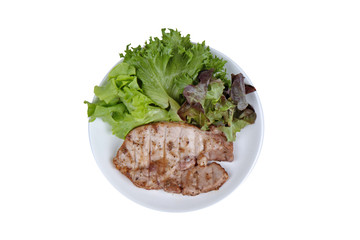 Pork Chop Steak served with mixed vegetable as red oak , green oak and lettuce