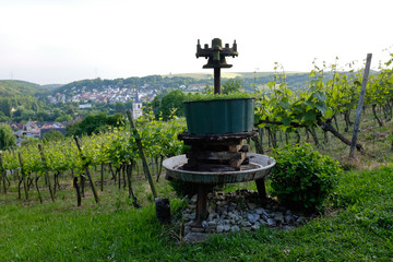 old wine press in rural vineyard landscape