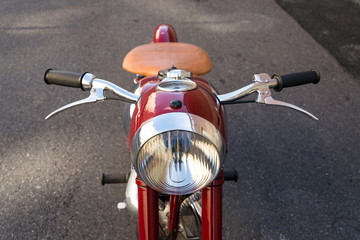 Detail of red vintage motorcycle Jawa 125 produced in former Czechoslovakia