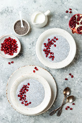 Healthy breakfast set. Chia seed pudding bowls with pomegranate.
