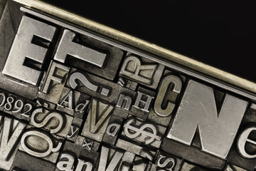 Metal Letterpress Types.
A background from many historical typography letters in black and white with white background.