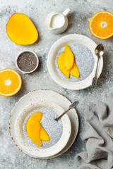 Healthy breakfast set. Chia seed pudding bowls with mango.