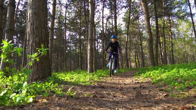 cyclist riding mountain bike in the forest