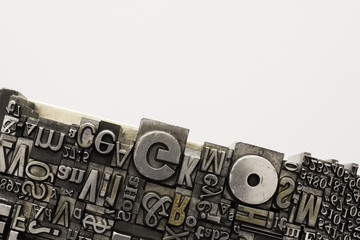 Metal Letterpress Types.
A background from many historical typography letters in black and white with white background.
