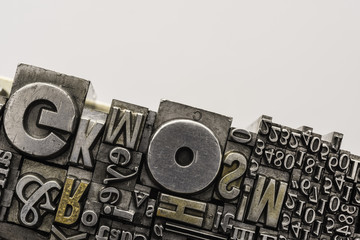 Metal Letterpress Types.
A background from many historical typography letters in black and white with white background.