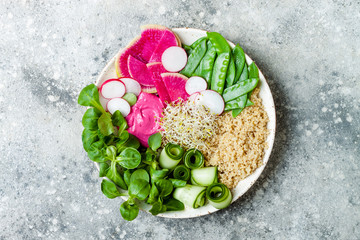 Vegan, detox Buddha bowl recipe with quinoa, snow peas, cucumber, watermelon radish, beet hummus, alfalfa seed sprouts