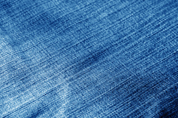 Navy blue color jeans cloth pattern with blur effect.