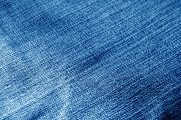 Navy blue color jeans cloth pattern with blur effect.