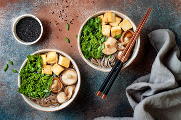 Miso and soba noodles soup with kale, shiitake mushrooms, .roasted tofu