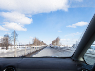 Fototapeta na wymiar driving along M1 highway in Russia in wither day