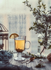 Fresh green tea. Tea cup with green tea leaf on the wooden table. Tea with lemon