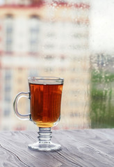 Fresh green tea. Tea cup with green tea leaf on the wooden table. Tea with lemon