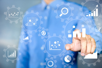 Business Process Data Analysis concept. Businessman touching Gear cogs is connected to financial charts, KPI, and graphs.