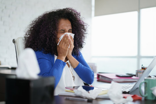Black Woman Working from Home And Sneezing For Cold