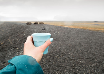 girl tourist holding a glass