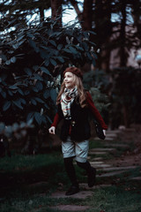 Young girl walking in the Park. Laughter, smile, style, Fashion.