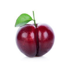 red cherry plum with green leaves isolated on white background.clipping path