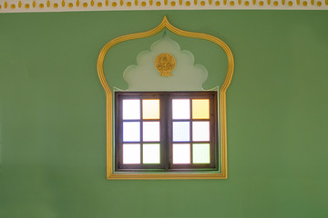 The window is a multicolored mirror. The reflection is beautiful.