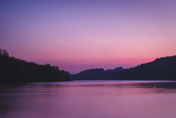 Fototapeta premium Beautiful sunrise over the river reflected sky in the river