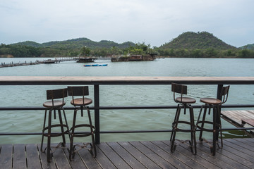 Fototapeta na wymiar Outdoor counter bar with beautiful lake view in vintage style