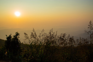Obraz premium Light sunset behind the mountains Nern Chang Suek hills, Kanchanaburi, Thailand