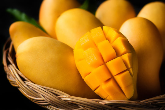 Yellow Mango Beautiful skin In the basket Blackboard background