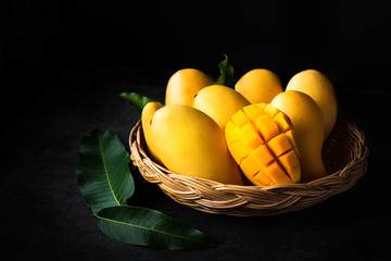 Yellow Mango Beautiful skin In the basket Blackboard background