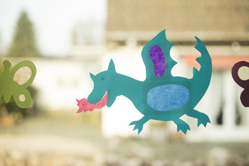 Shape of a dragon made with paper as handicraft activity for children © lobro