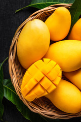 Yellow Mango Beautiful skin In the basket Blackboard background