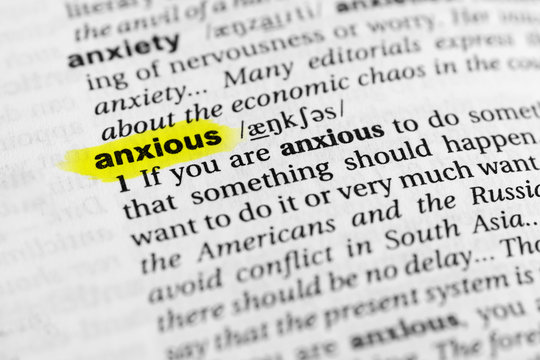Highlighted English word "anxious" and its definition in the dictionary