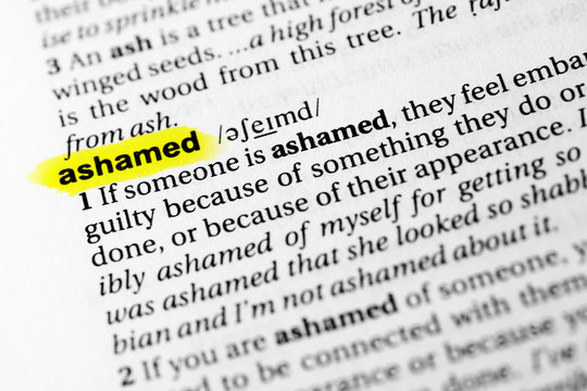 Highlighted English word "ashamed" and its definition in the dictionary