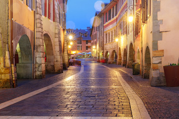 Nice street Rue Sainte-Claire in Old Town of Annecy at rainy night, France