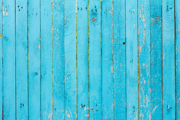 Fototapeta na wymiar wooden background, old village fence, painted blue