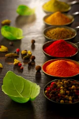 Schilderijen op glas Wooden table of colorful spices © alefat
