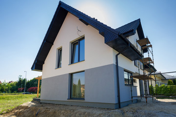 Newly built house with a finished plaster and paint
