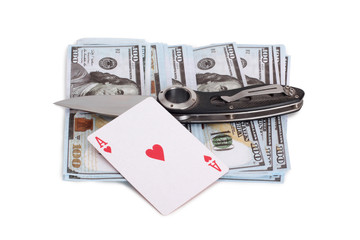 Playing cards and paper dollars on a white background