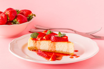 Delicious homemade cheesecake with strawberries.