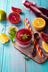 Healthy vanilla chia pudding in a glass on blue background