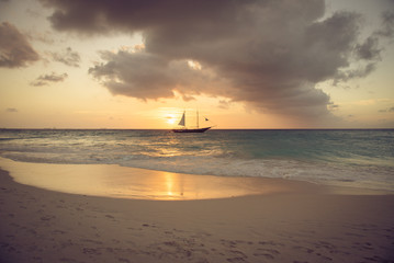 Idyllic caribbean beach at sunset