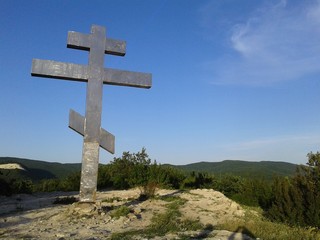 Big cross on the mountain. beautiful nature.