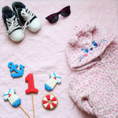 Flat Lay baby pink with boots, jacket and sunglasses
