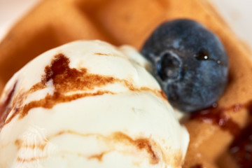 Dessert dish. Belgian waffles with ice cream, blueberries and raspberries.