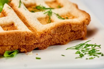 Waffle sandwich with ham and salad./Crispy sandwich with ham and salad. Breakfast.