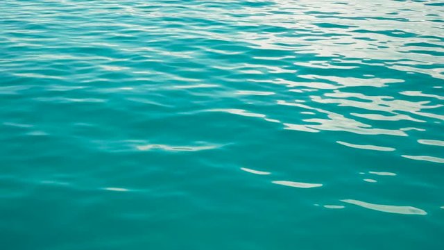 Water ripples on the surface of azure water