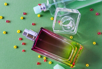 A perfumes on a green background.